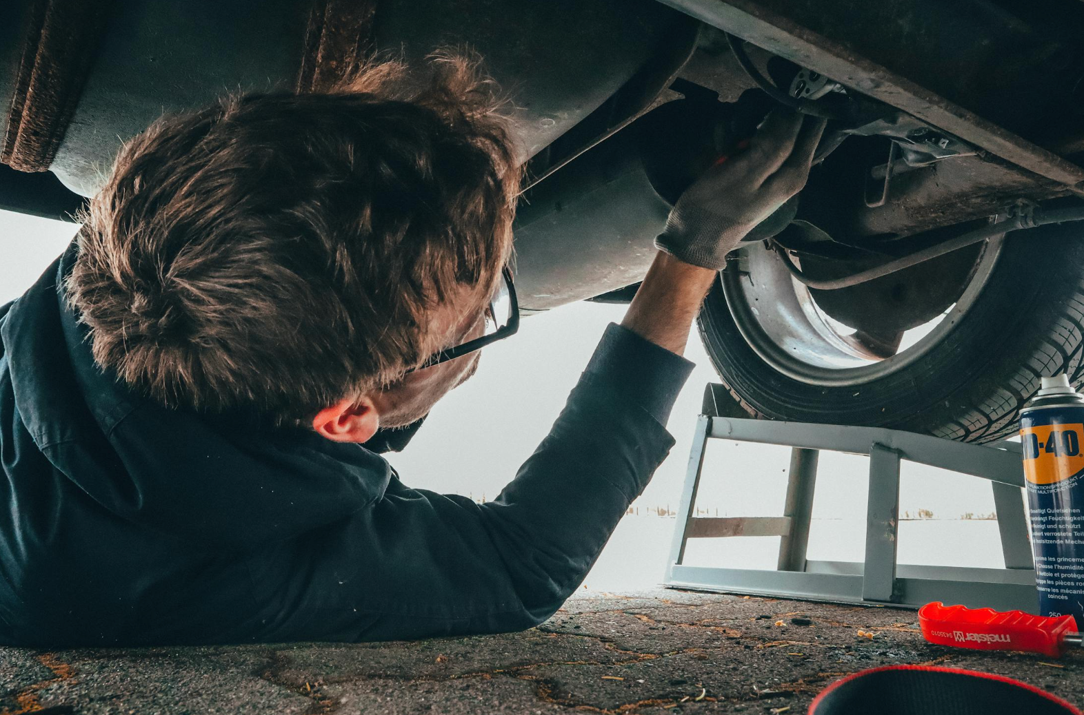 mechanic working under a car